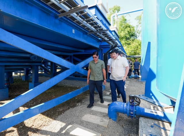The president of the Philippines inspecting the water treatment plant.