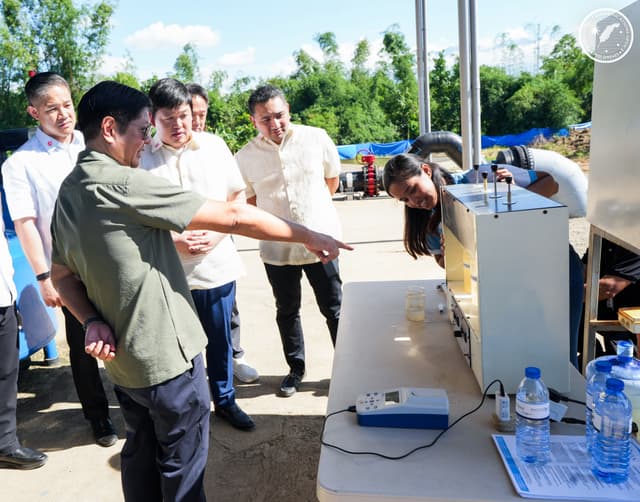 The president of the Philippines inspecting the water treatment plant.